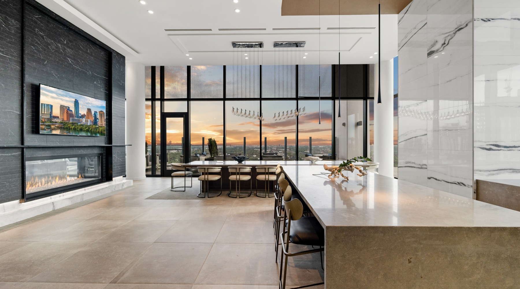 lounge space with floor to ceiling windows and fireplace 