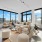 corner apartment with floor to ceiling windows and sectional couch