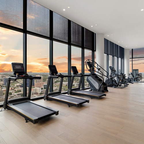 Fitness Center recessed lighting throughout fitness center with downtown city views