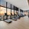 recessed lighting throughout fitness center with downtown city views