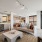 large living room with track lighting and access to private balcony